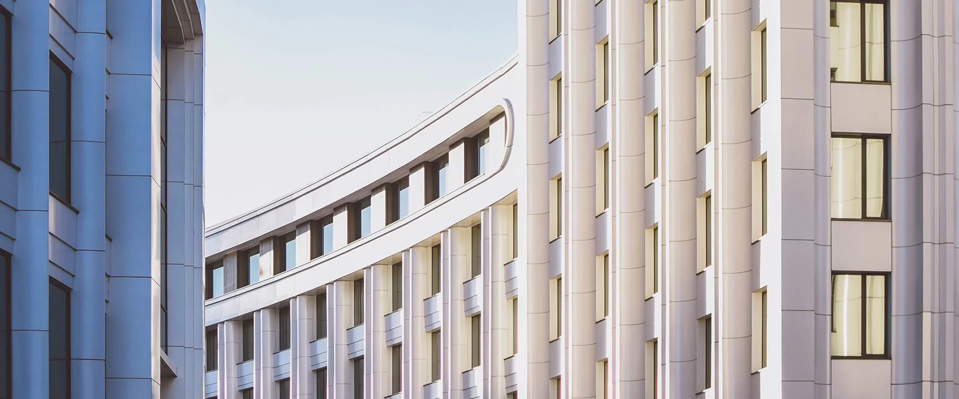 A view of a white building with windows.