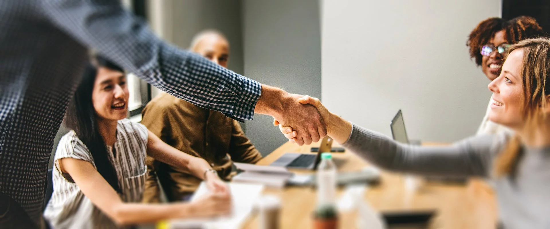 Handshake over a table