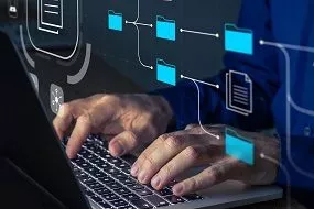 Hands writting on a laptop