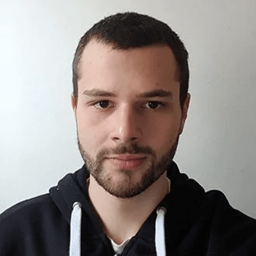 One man wearing a black hoodie is taking a selfie.