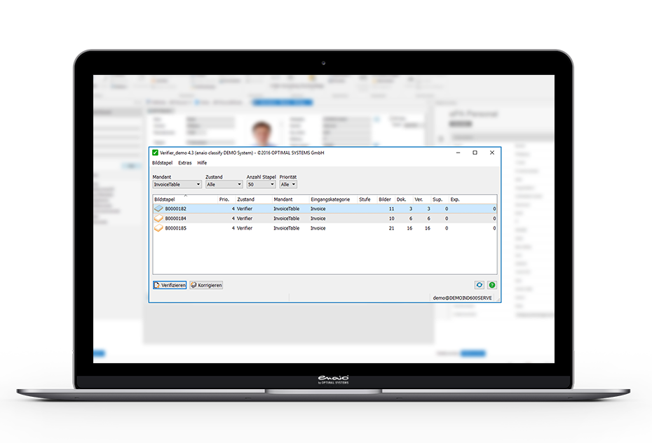 A laptop with a screen showing a patient's information for document classification.